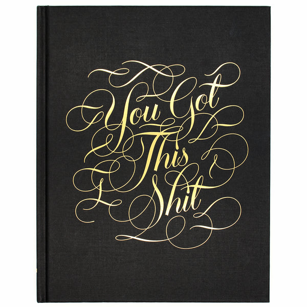 From our bestselling Calligraphuck line, this luxe hardbound journal features uplifting profanity in gold foil-stamped calligraphy on the cover.  With gilded edges, lined and blank pages, and metallic flourishes throughout, 'You Got This Shit' is the journal for anyone who appreciates sassy words of encouragement.  Size: 19 W x 24 L cm