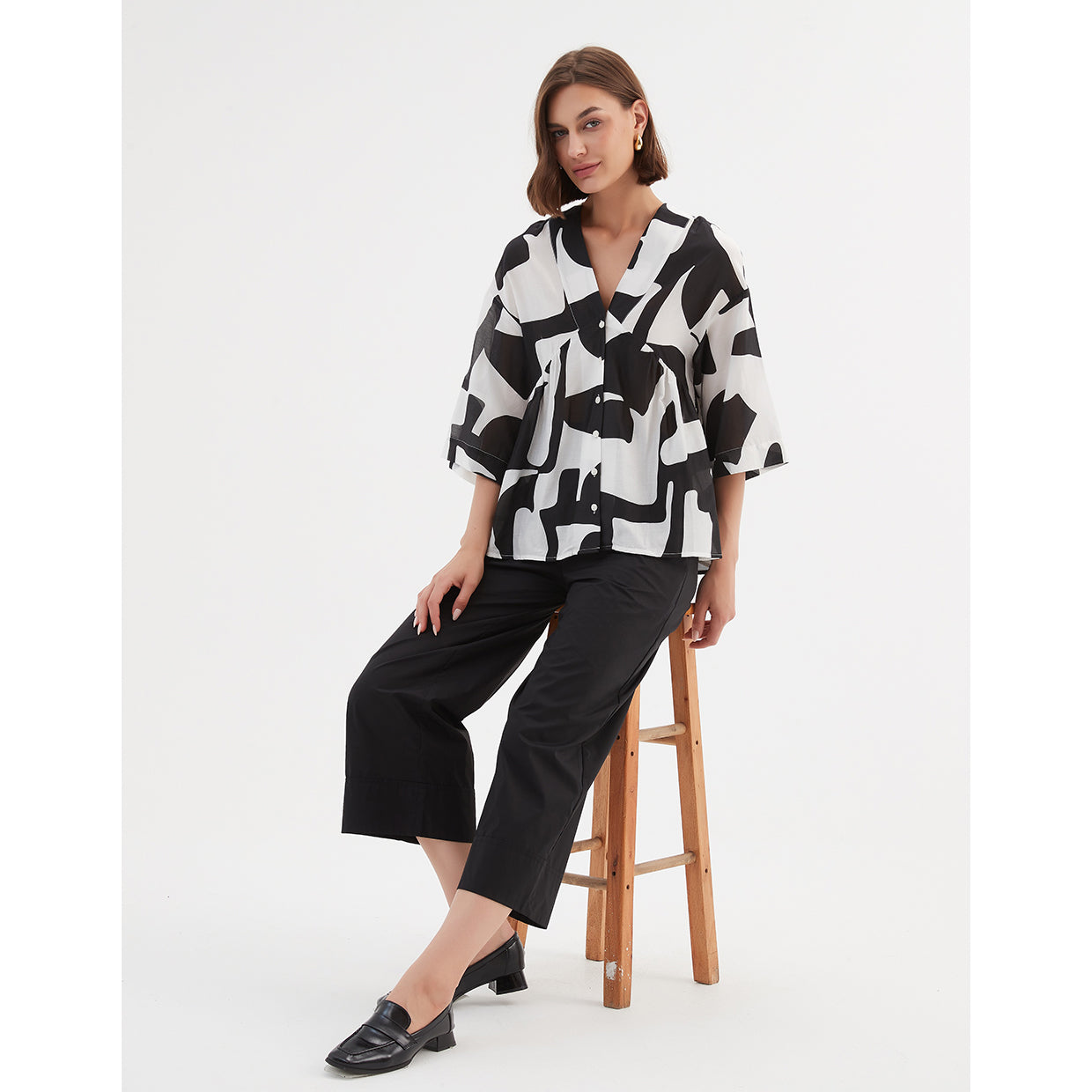 V Neck Peplum Top Black Abstract