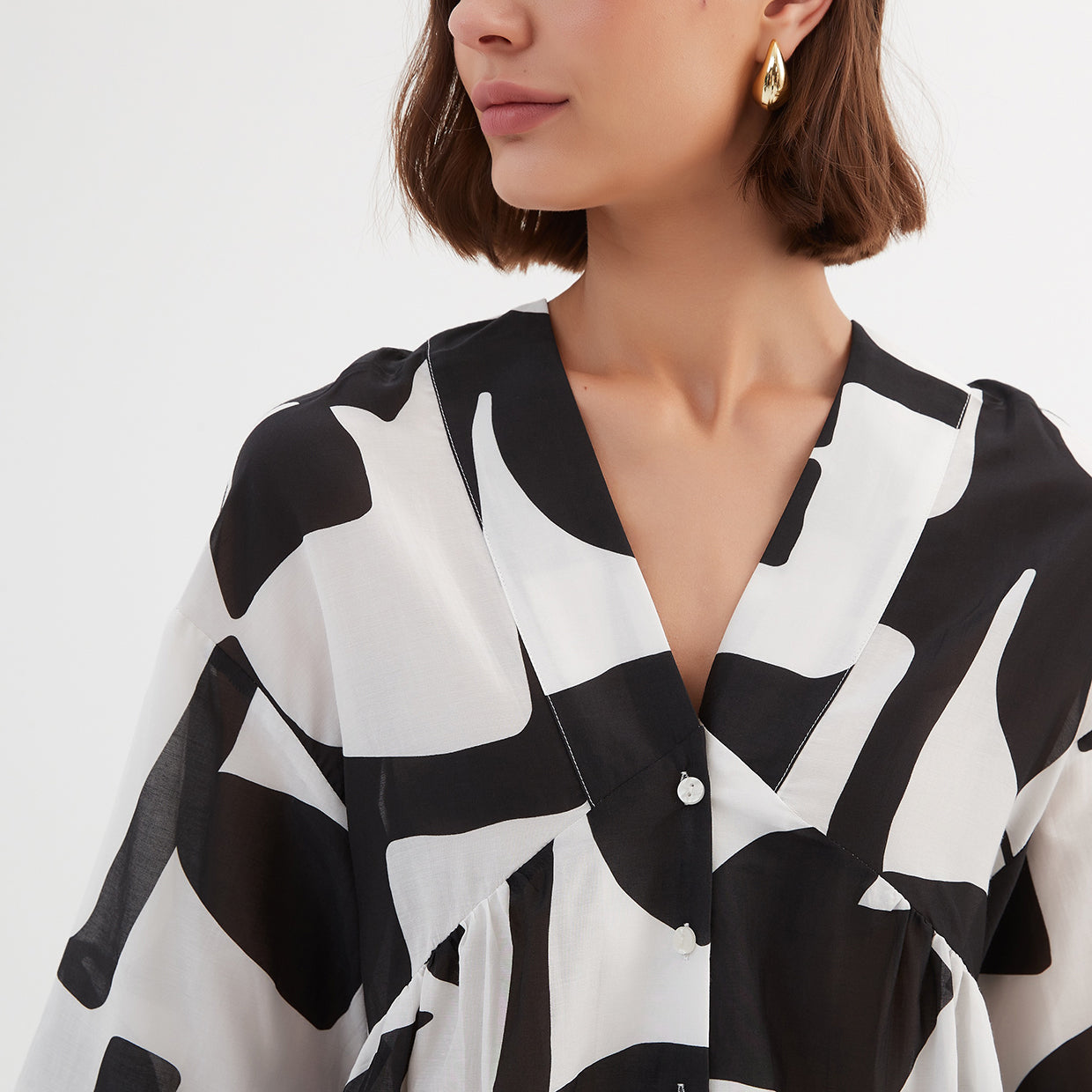 V Neck Peplum Top Black Abstract