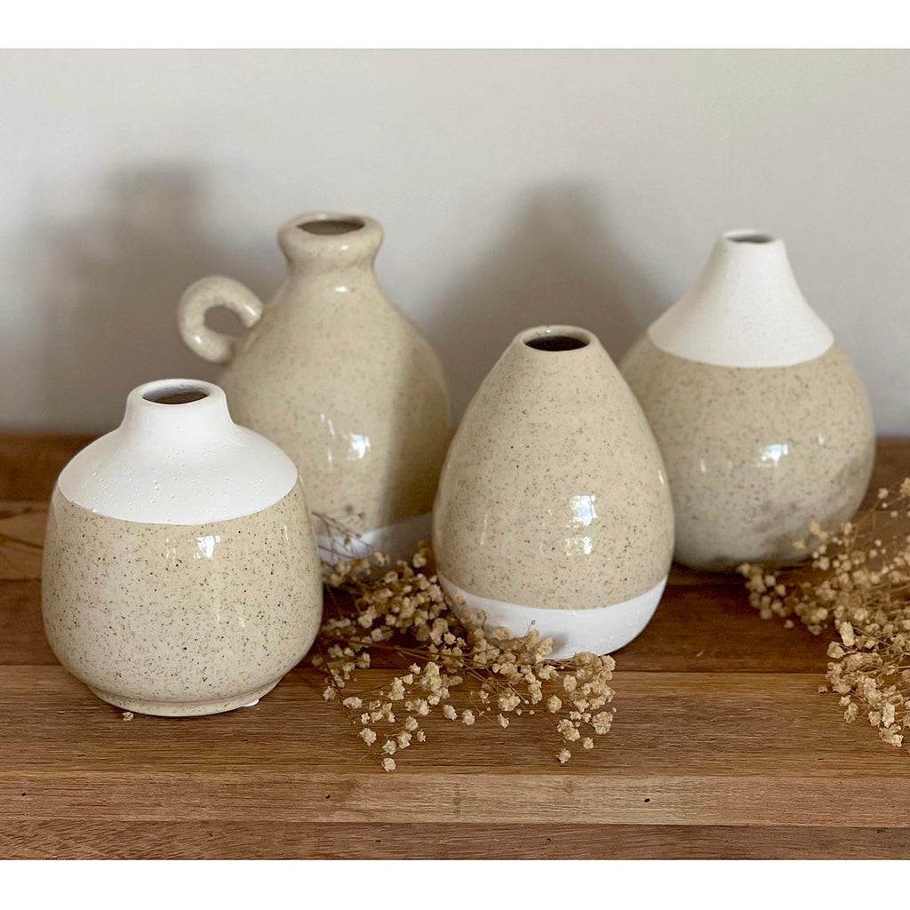 The Charlie Vase, inspired by Vietnamese artisans, these vases give that hand-crafted feel, moulded into a beautiful vase. Choose from these 4 gorgeous styles. Mrs Kelp -  13cm dia. x 15cm h Auntie Marina - 10cm dia. x 13.5cm h  Dimitris - 11.5cm dia. x 12.5cm h Dr. Geleo - 12cm dia. 15.5cm h