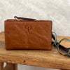 Medium size coin and card wallet. 9 card spaces, zip closure for coins, note space. Available in tan or black.  Size: W14 x H9 cm