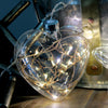 Light up your world with some hanging glass lights. Add a beautiful twinkle to your home, perfect for living, ambience, or special occasions.  10 x warm white LED seed lights Clear Glass - Copper Wire 25cm hanging cord with on/off switch that doubles as a subtle battery pack Powered by CR2032 batteries, included