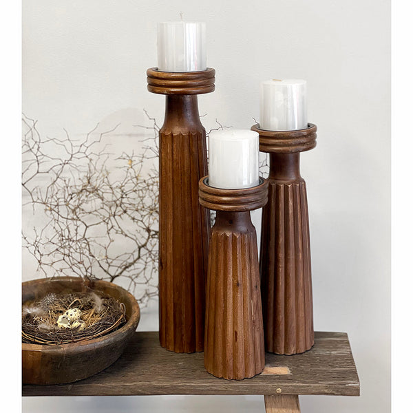 These chunky Emmis hand carved wood candle holders will make a statement in any setting. Buy individually, as pairs in the same size or the set of 3. (candles sold separately)