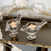 These lovely glass bird tealight candleholders bring a touch of whimsy with their playful shape and delicate sparkle. This clear glass candle holder makes a delightful addition to your decor with it's simple, pleasing shape. These little birds evoke beauty of nature while the cust glass offers a glamorous feel.  DETAILS: 100% GLASS 12x6x7cm price includes tealight candle