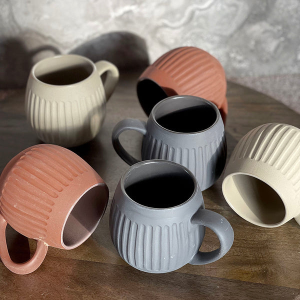 Introducing the new Hug Me Mugs with unique etching details. Available in three earth inspired clay finishes. Hug me mugs are custom designed to be cupped in your hands. This collection is perfect for that warming cuppa.   Details: • High fired stoneware  • Oven, microwave and dishwasher safe • Stunning textured clay body. • 400ml Capacity • Designed in Australia, Made in China • gift boxed in sets of 4