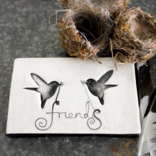 Handmade in NZ!  Ceramic tile featuring imprinted birds and 'friends'  Ideal for the wall or adorn any coffee table or bedside table in the house.  Size: 11 W x 16.5 L x 1.7 H cm approx