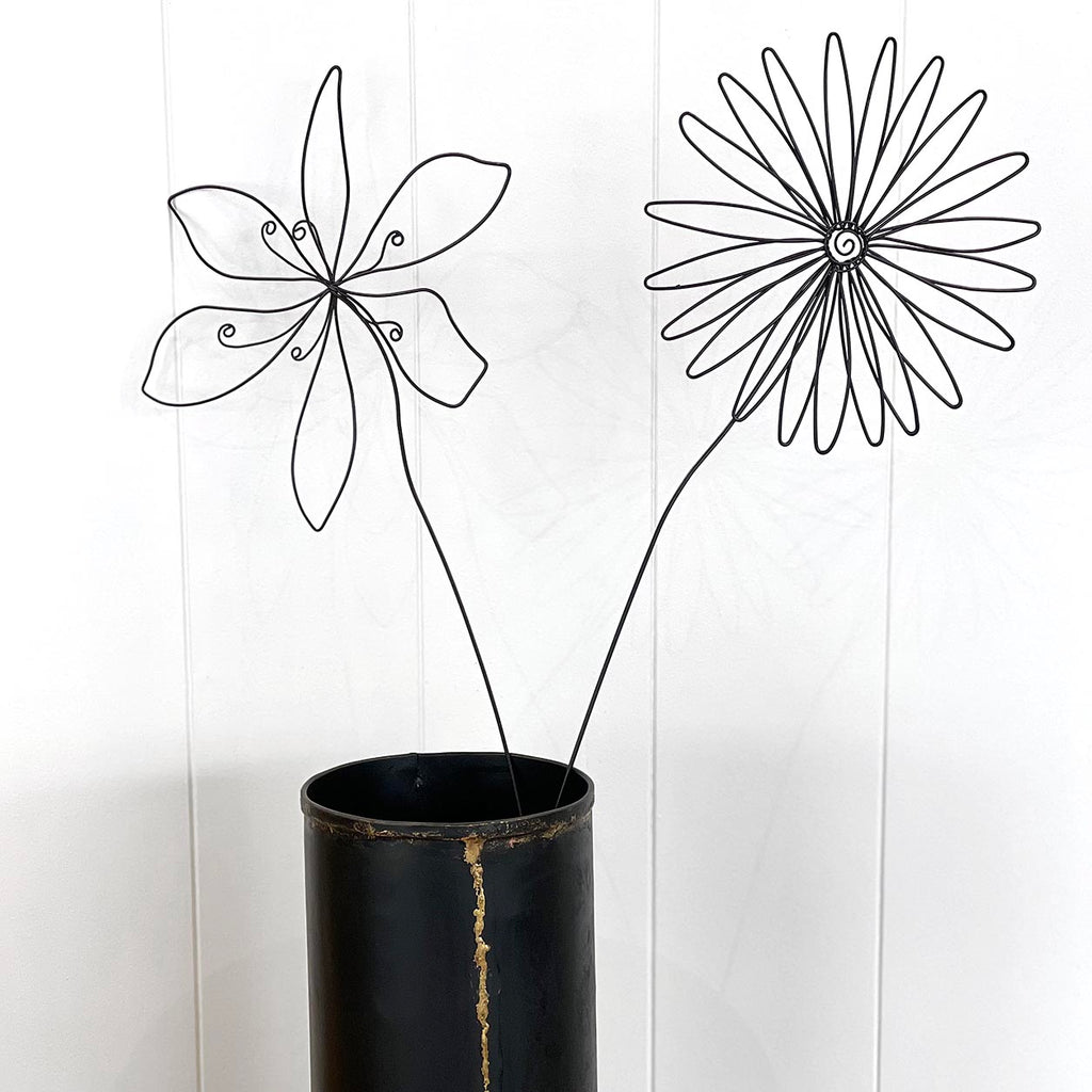 Whether a pretty highlight in a vase, a friendly companion in a pen holder or a sweet surprise in a flower pot, these wire ornaments will awake your creativity and will always bring you joy no matter how you use them.  Details: Decorative wire art Two blossoms to choose from Approx 50x17cm