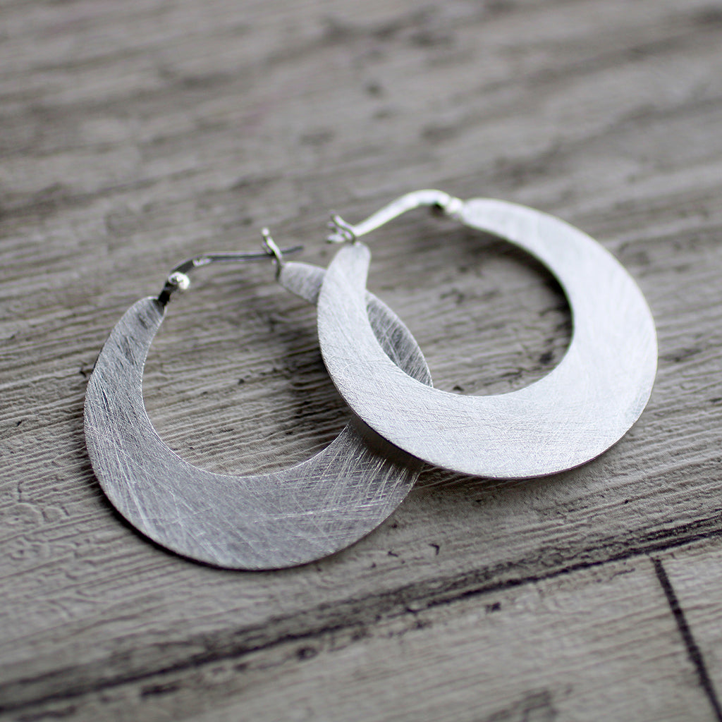 Brushed Cutout Disc SS Earrings  Details: • Sterling Silver brushed  All our materials/products are ethically sourced and manufactured