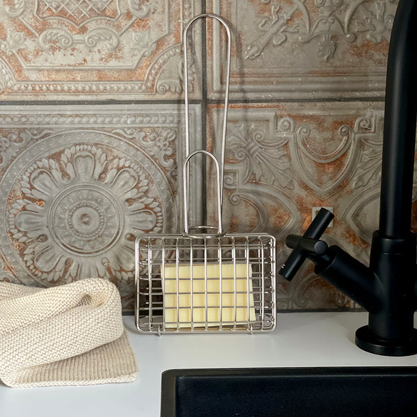 What is old is new again! The Florence Soap Shaker is the practical way to be plastic free. Made from stainless steel, the Florence Soap Shaker will last a lifetime. Use a soap shaker with a bar soap instead of liquid detergent. Pop a bar of the soap of your choice into the cage and swish it in hot water to obtain a lather. Also useful in the laundry or anywhere else you want a soapy lather.   Cage Size: 110 x 75 x 40mm This is for the shaker only - soap in the photo is not included. 