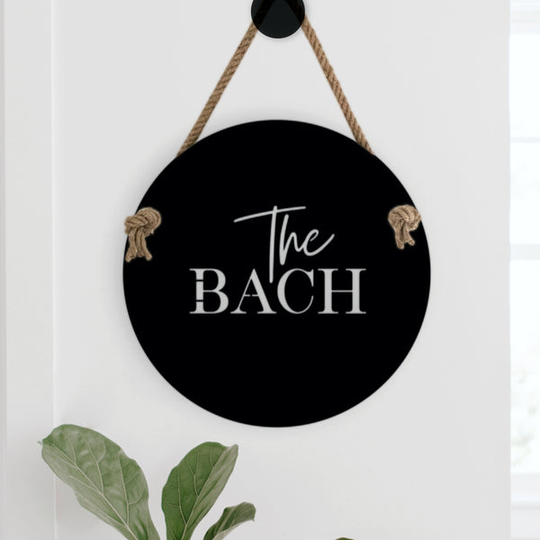 The perfect welcome sign for your bach or beach house. Suitable for indoors or outdoors, The Bach measures 400mm diameter and includes 1 metre of quality jute hemp rope.  Cut from premium quality stainless steel, The Bach is finished in electro coated matte black.  Suitable for outdoor use. The perfect sign for your beach house or for a beach lover at home.