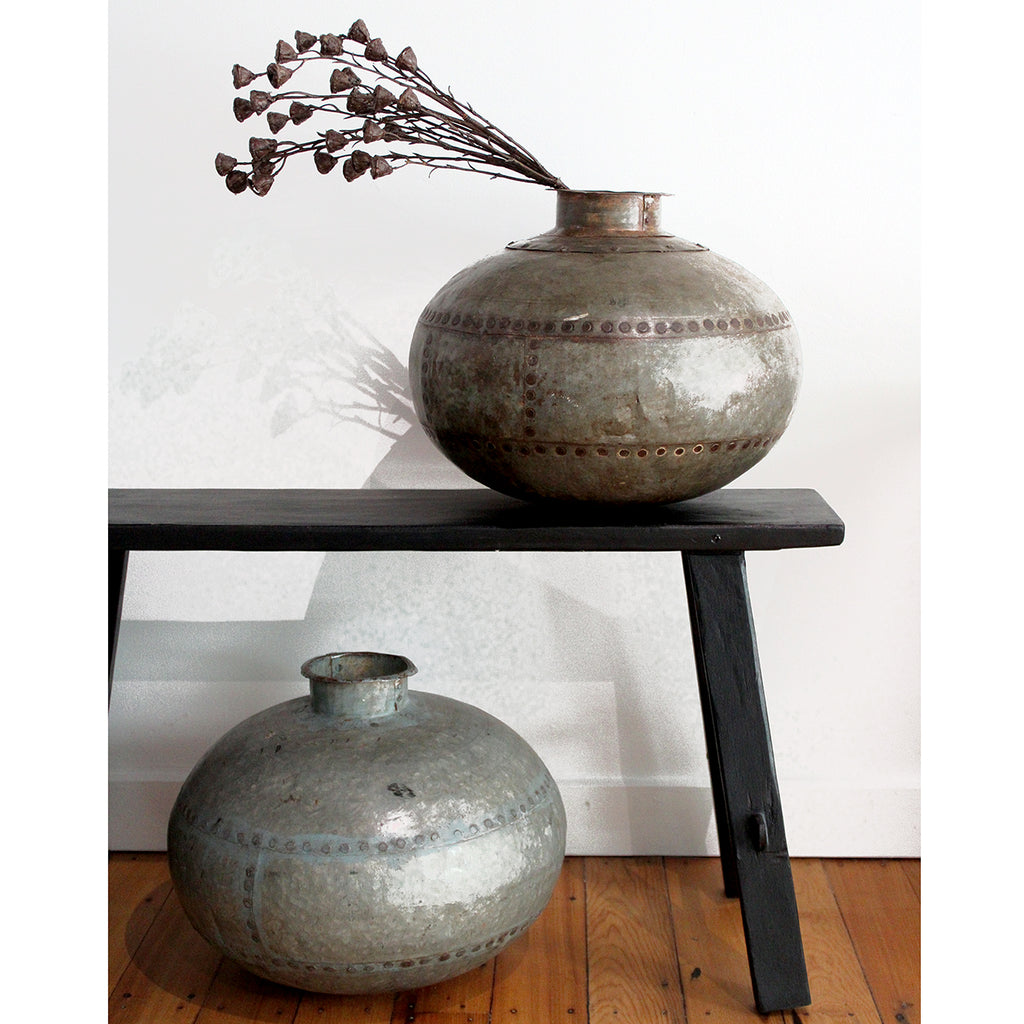 Wonderfully rustic, with exposed rivets, no two pots are the same. These make a great statement on their own or use them to display a few dried flowers.  The Torlouse Iron Pot can be used outside however they will age and some surface rust may occur over time. This can be minimized by spraying with a product like Penetrol  Handcrafted using recycled iron.  Size:  H29 x D35cm