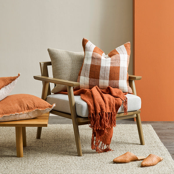 Inspire memories of sun drenched summer picnics with this classic plaid cushion. In a modern twist this traditional pattern is re-imagined in raw linen and a rich tobacco colour.  Size: 50x50 Includes Feather Innder 100% Linen